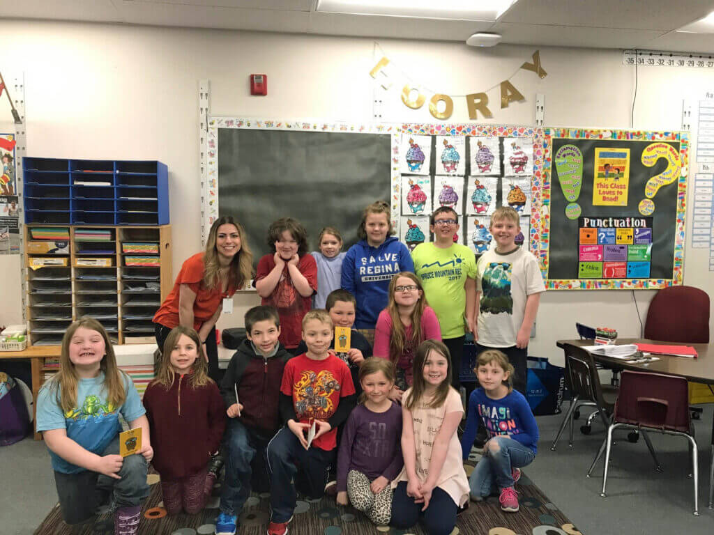 Marketing and Communications Director Sarah Hayes is pictured with Mrs. Pettengill's 2nd grade class