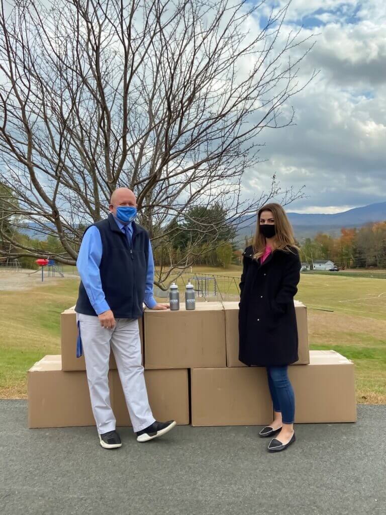 Sarah Hayes of OTIS Federal Credit Union Donates Water Bottles to MSAD 58 School District