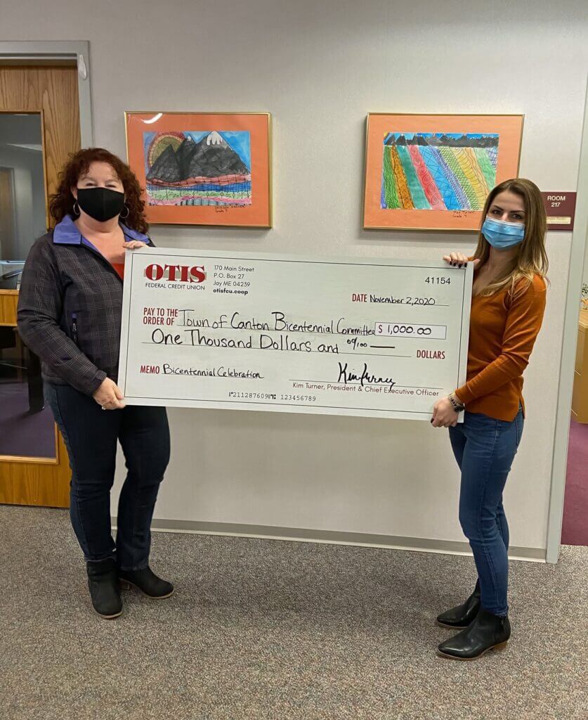 Sarah, Marketing Director at OTIS Federal Credit Union, presents a sponsorship check to Canton Bicentennial Committee member