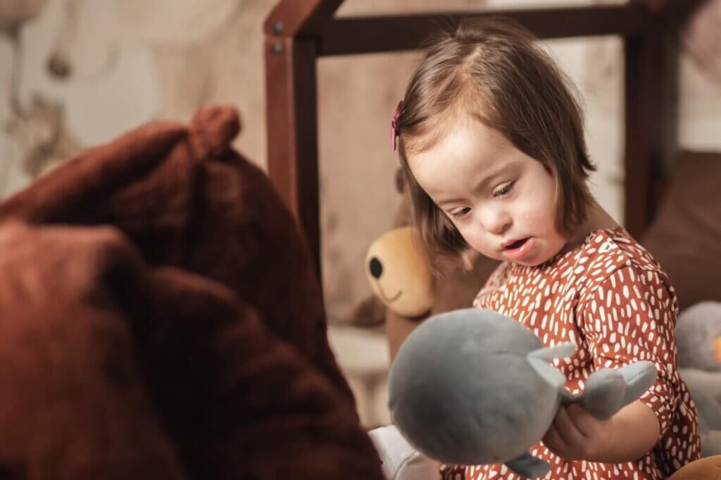child playing with stuffed animals