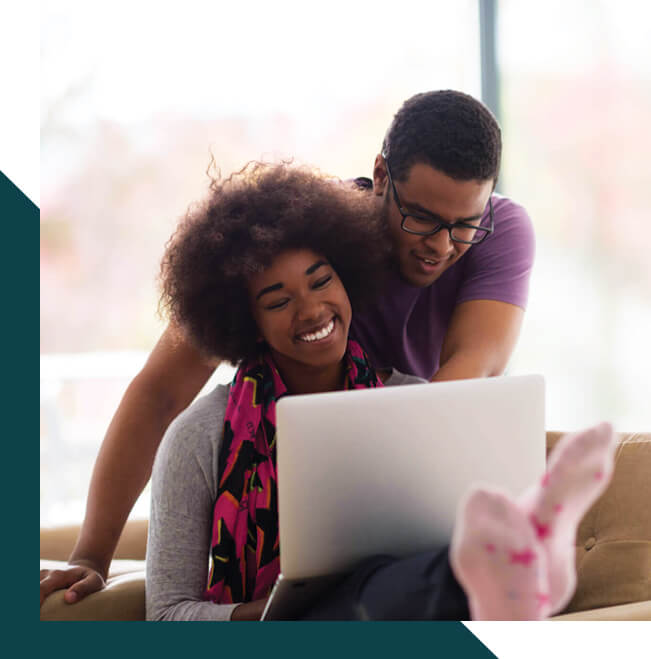 young couple looking at laptop together