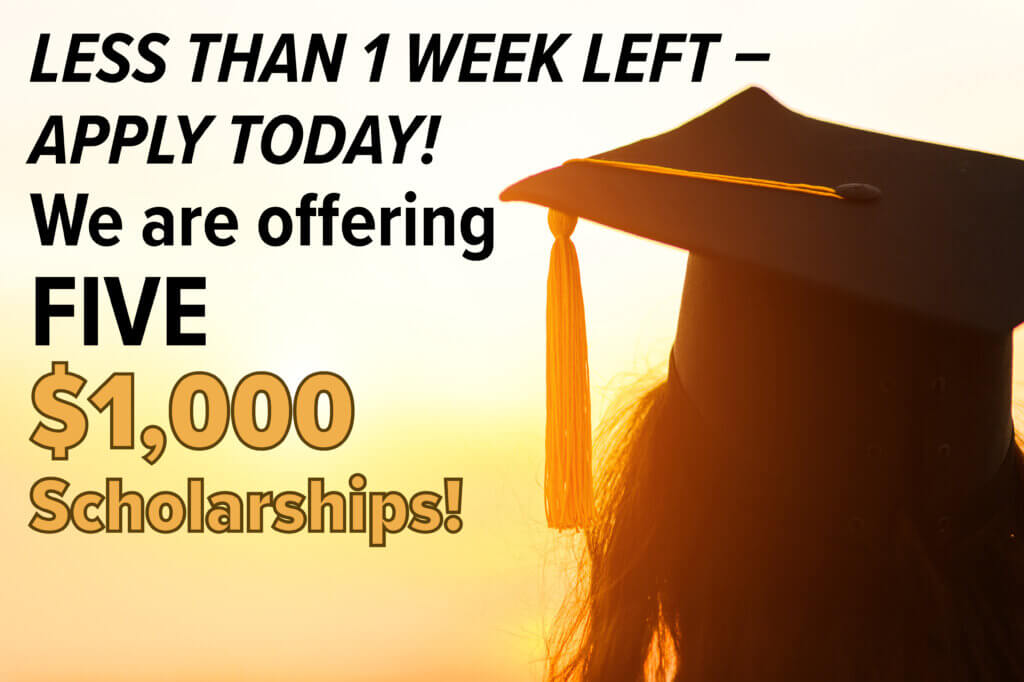 Graduate with long hair facing sunset. Less Than 1 Week Left to Apply for $1,000 Scholarships.