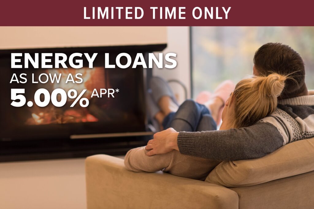 couple in front of fireplace - click to learn more about energy loan special